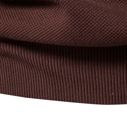Close-up of the fabric detail of the Stand Collar Half-Zip Knit Sweater in brown.