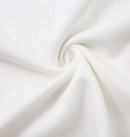 Close-up of the fabric used in the Retro Embroidered Patchwork Polo Hoodie, showcasing its soft white texture.