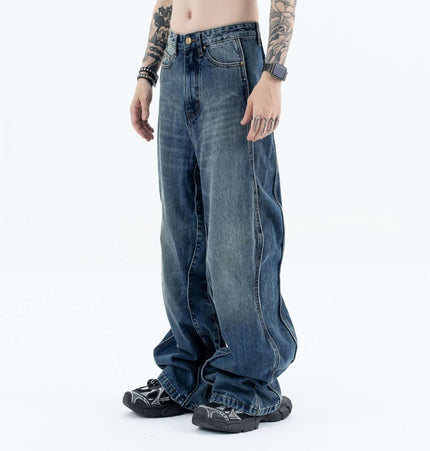 Wave Washed Distressed Jeans – Loose Fit displayed on a model, showcasing relaxed street style and vintage character.