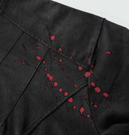 Retro Splatter Print TShirt – Loose Fit featuring unique red splatter design on a black fabric.