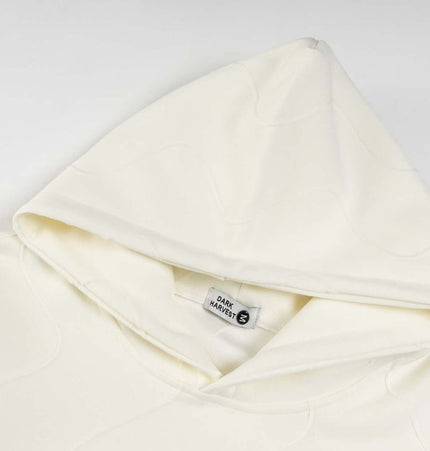 Embroidered Letter Hoodie – Loose Fit with a soft beige hood detail.
