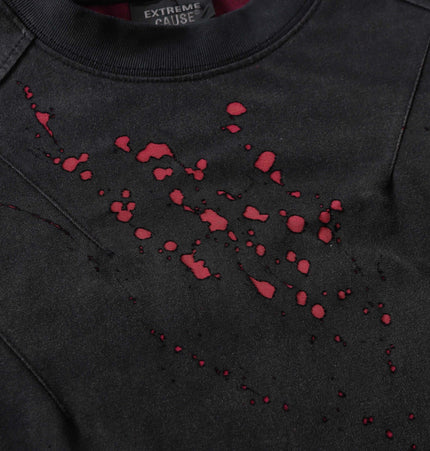 Retro Splatter Print TShirt – Loose Fit design featuring faded splatter print and creative detailing on black fabric.