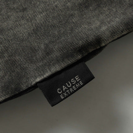 Close-up of the label from the Retro Washed Pocket Embroidery T-Shirt – Loose Fit, showcasing premium fabric texture.