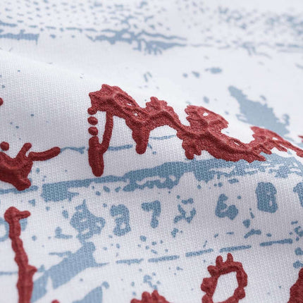 Close-up of the graphic print on the Retro Washed Face Letter T-Shirt – Loose Fit featuring bold lettering.