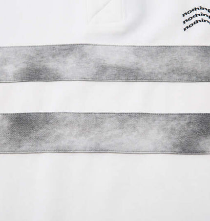 Detail of Retro Embroidered Patchwork Polo Hoodie showcasing patchwork design and embroidered lettering.