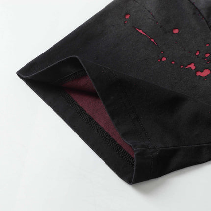 Close-up of the Retro Splatter Print T-Shirt – Loose Fit showcasing the washed faded fabric and splatter design.