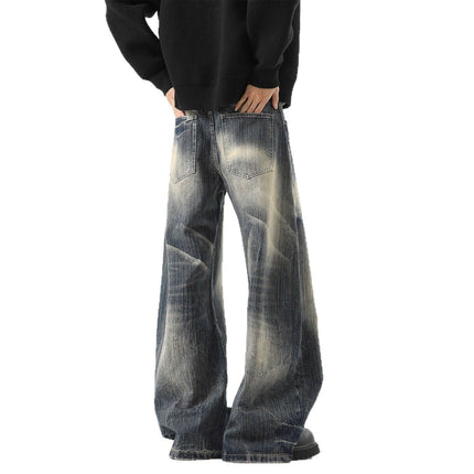 Knife-Edge Denim Trousers – Loose Fit showcased from the back, featuring wide legs and a washed distressed finish.