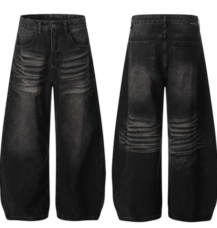 Washed Black Vintage Knife Cut Jeans featuring cat whisker detail and loose fit silhouette.