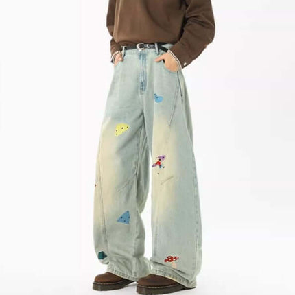 Knife-Cut Embroidered Pants – Loose Fit showcasing relaxed style with deconstructed design and colorful embroidery accents.
