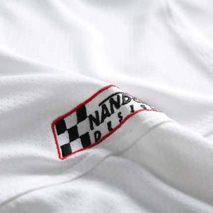 Close-up of Digital Print Jersey TShirt - Loose Fit showcasing logo detail on fabric.