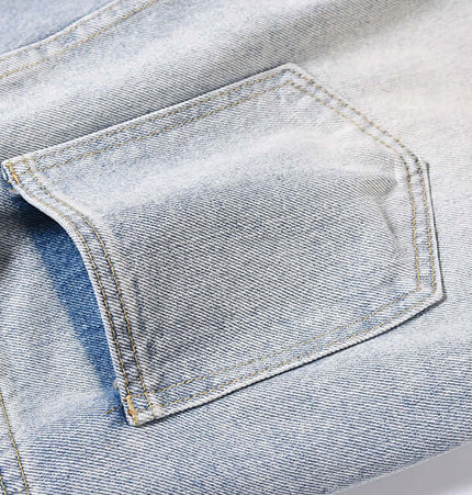 Detail of the pocket on Washed Micro Flared Jeans – Loose Fit, showcasing vintage blue denim finish.