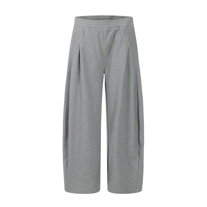 Model wearing Black straight leg tapered sweatpants by Grozavu