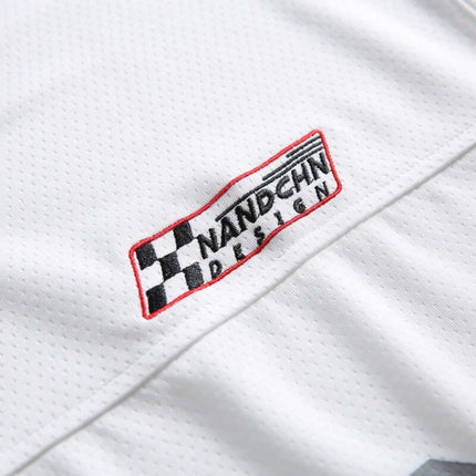 Embroidered logo on Digital Print Jersey TShirt - Loose Fit, showcasing modern sporty style and attention to detail.