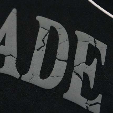 Close-up of the printed design on the Faux Suede Printed Hoodie – Loose Fit, showcasing its bold vintage style.