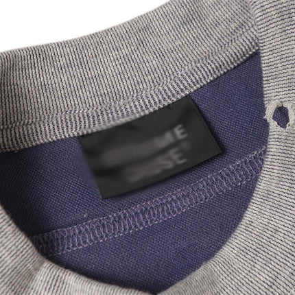 Punk Distressed Short Sleeve T-Shirt – Loose Fit showing distressed fabric and tag detail.