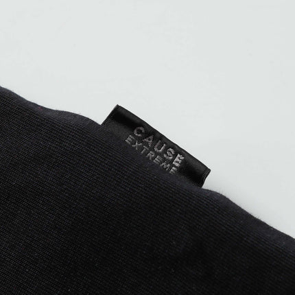 Close-up of the label on the Grozavu Retro Splatter Print T-Shirt – Loose Fit showcasing the 'CAUSE EXTREME' tag.