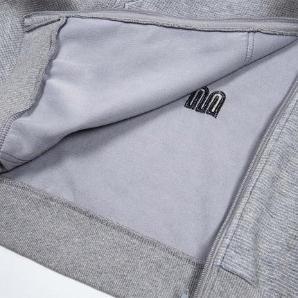 Sudadera con capucha con cremallera bordada de letras desgastadas – Corte holgado