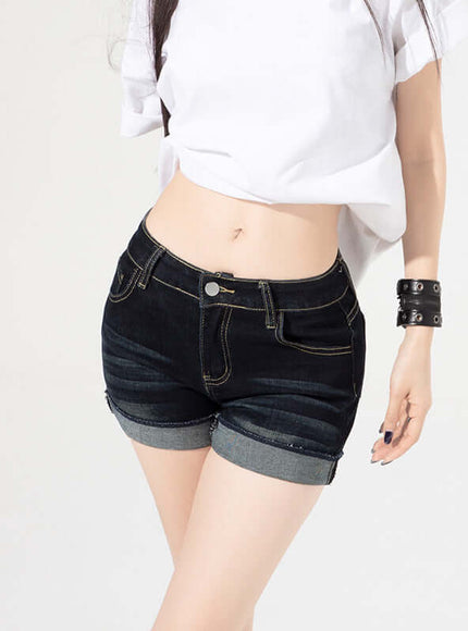 Black low rise cuffed shorts with Grozavu logo