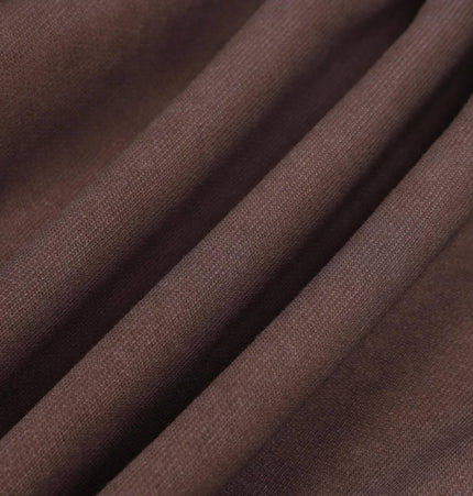 Close-up of soft brown fabric showcasing texture for the Old Patchwork Hoodie – Loose Fit.