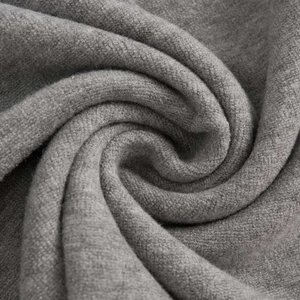 Close-up of soft, gray fabric showcasing texture for the Stand Collar Button Hoodie – Loose Fit.