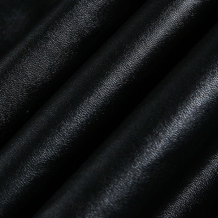 Black faux leather fabric showcasing texture for the Oversized Reversible Hooded Parka.