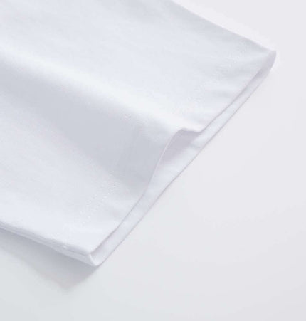 Close-up view of the sleeve of a Retro Washed Face Letter TShirt – Loose Fit, showcasing the fabric and design.