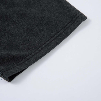 Close-up of the sleeve of the Retro Washed Badge Letter T-Shirt – Loose Fit showcasing the relaxed fit and premium fabric.