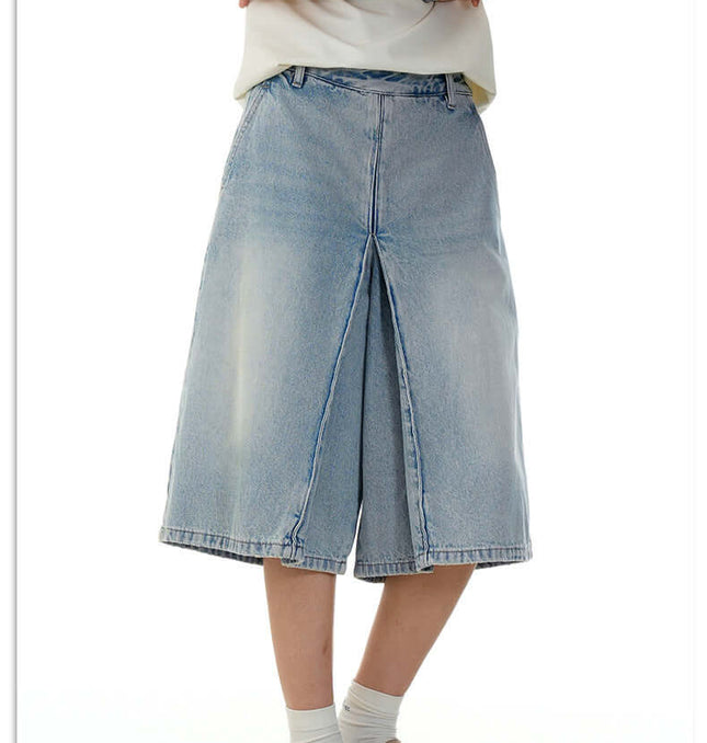 Washed Blue Denim Shorts – Loose Fit worn by a person showcasing vintage-inspired summer style.