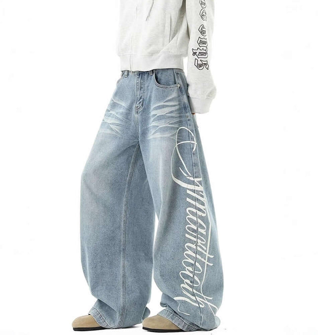 Washed Letter Print Jeans - Loose Fit featuring a wide-leg silhouette in distressed denim with bold letter print detailing.