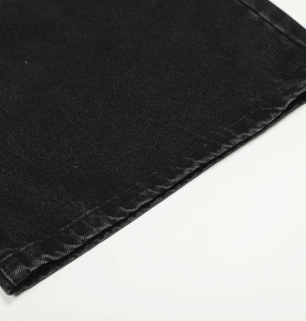 Washed Black Vintage Knife Cut Jeans close-up of hem detail on durable black cotton denim.