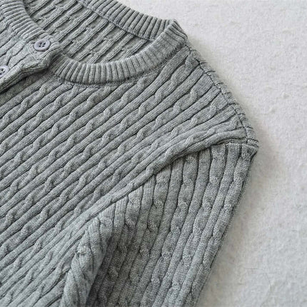 Round Neck Half-Button Knit Sweater in soft gray texture with half-button placket and ribbed neckline.
