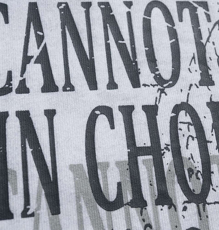 Close-up of the graphic print on the Retro Washed Castle Letter TShirt – Loose Fit, showcasing vintage text design.