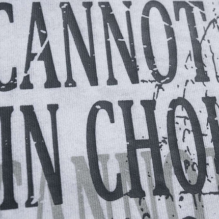 Close-up of the printed text on the Retro Washed Face Letter T-Shirt – Loose Fit, showcasing its bold graphic design.