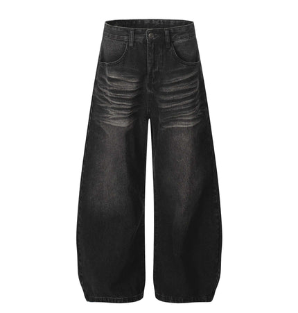 Washed Black Vintage Knife Cut Jeans featuring cat whisker fade and relaxed fit for street style.