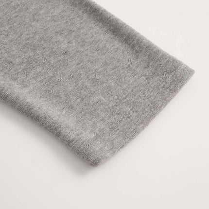 Close-up of the sleeve hem of the Stand Collar Button Hoodie – Loose Fit in soft grey fabric.
