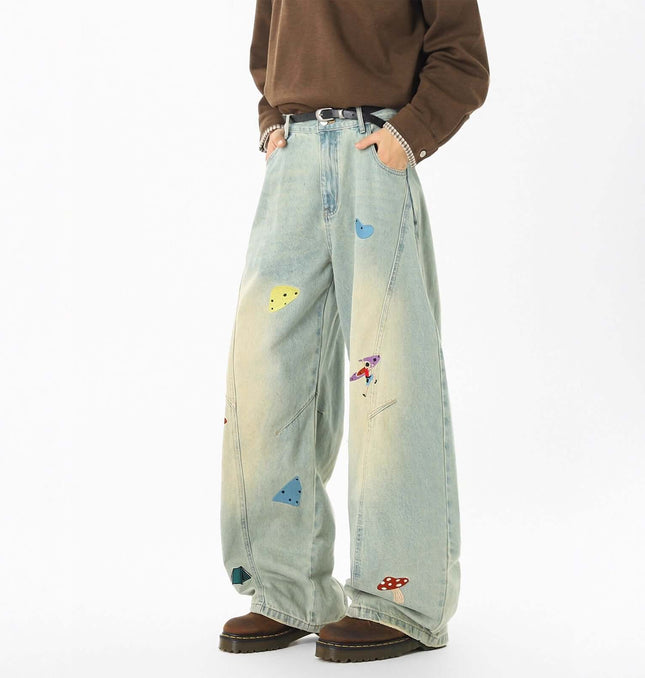 Embroidered Patchwork Denim Pants featuring playful designs and a loose fit, perfect for casual streetwear.