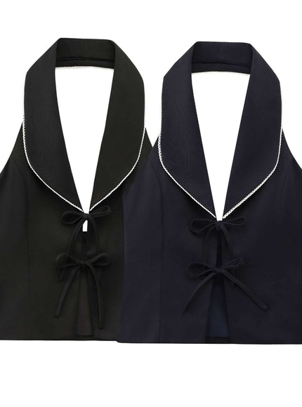 Close-up of black sleeveless bow decoration patchwork neck fabric