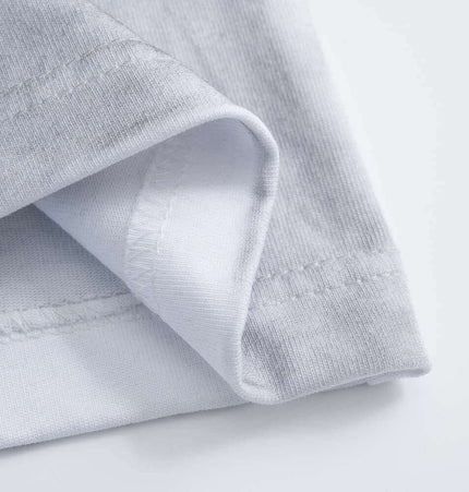 Close-up of the soft fabric and stitching of the Retro Washed Face Letter TShirt – Loose Fit.