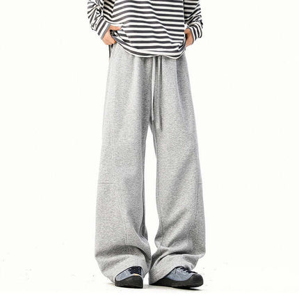 Heavyweight Wide-Leg Pants - Loose Fit displayed on a model wearing a striped top and casual sneakers.