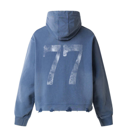 Washed Rhinestone Letter Hoodie – Loose Fit featuring vintage washed blue finish and distressed hem with 77 graphic on back.