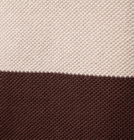 Close-up of the color-blocked design of the Stand Collar Half-Zip Knit Sweater showcasing the fabric textures.