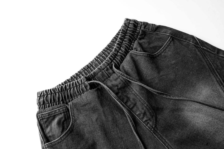 Pantalons en denim délavés usés plissés à revers de style urbain unisexe à jambes larges et droites