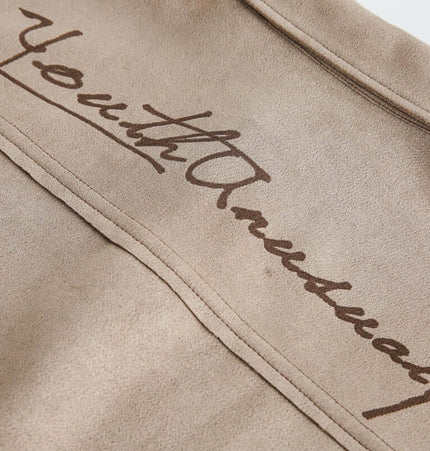 Close-up of the fabric texture featuring the printed design on the Suede Short Sleeve Shirt - Loose Fit.