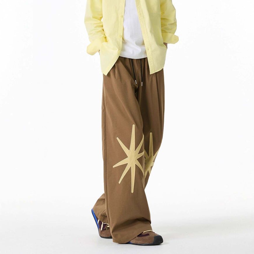 Model wearing Black patterned technical trousers by Grozavu