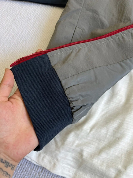 Veste de sport rétro à col montant en patchwork avec manches raglan à trois bandes