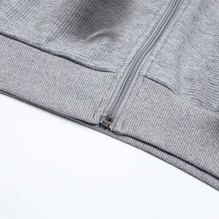 Sudadera con capucha con cremallera bordada de letras desgastadas – Corte holgado