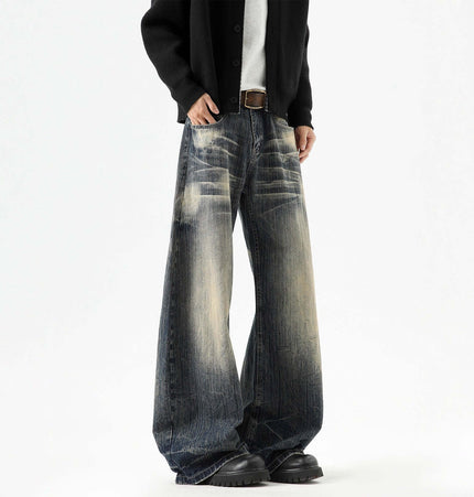 Knife-Edge Denim Trousers – Loose Fit featuring unique distressed detailing and relaxed silhouette.
