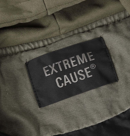 Extreme Cause clothing label inside a jacket, showcasing brand details and fabric care information.