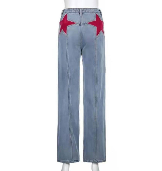 Light blue vintage-inspired bootcut denim trousers with red star details, high waist, relaxed fit, made from organic cotton and polyester fiber. Size S, M, L.