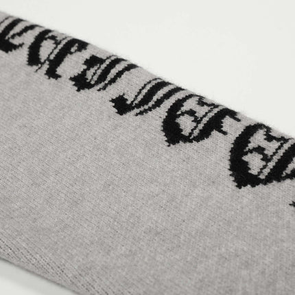 Letter Jacquard Knit Hoodie – Loose Fit close-up showing the bold letter jacquard pattern in gray and black.